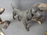 a statue of a dog that is standing next to a table