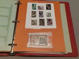 a red binder with stamps on it on a table