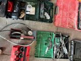a lot of tools that are laying out on the floor