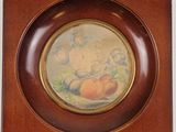painting of peachs in a wooden frame on a white background