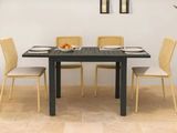 a table with four chairs and a bowl of fruit on it
