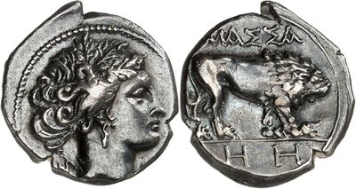 a silver coin with an image of a woman and a lion on it