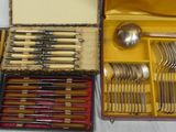 many different types of silverware in this case