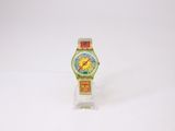 a small watch on a clear stand on a white surface