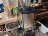 a coffee maker sitting on a counter in a kitchen