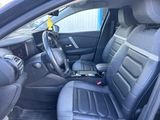 a car with a laptop in the back seat of it
