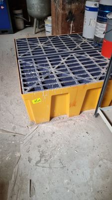 a yellow crate that is sitting on the floor