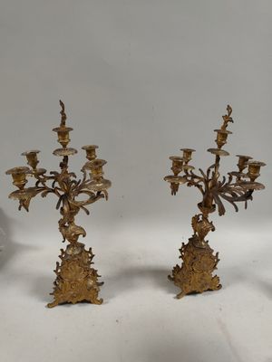 pair of antique brass candelabs with flowers and leaves