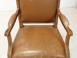 an image of a brown leather chair sitting on top of a white floor