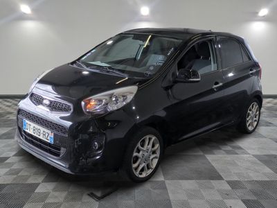 a picture of a small black car on a checkered floor