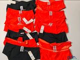 three pairs of men ' s underwear are lined up on a table