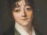 portrait of a young man in a green coat and white shirt