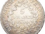 a silver five cents coin with a wreath on it