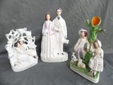 three figurines that are sitting on a table