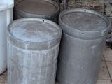 three trash cans sitting next to each other on the ground