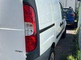 a white van that is parked in a parking lot
