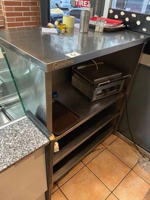 a counter that has a glass case on top of it