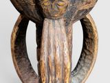 an image of a wooden bowl with a face on it