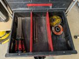 a tool box with tools inside of it on the floor