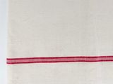 a close up of a white towel with red stripes on it