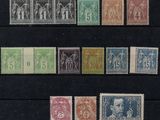 a group of stamps from different countries on a black surface