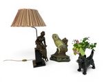 a lamp that is sitting next to a vase with flowers