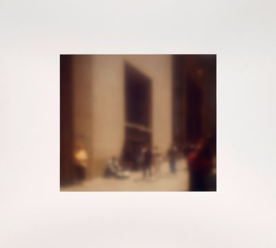 a blurry photo of a living room with a couch and coffee table