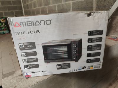 packaging for a toaster oven sitting on top of a cardboard box