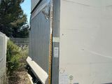 a truck that is parked next to a fence