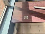 a cup of coffee on a table next to a window