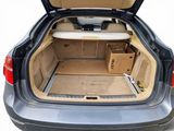 a trunk of a car with a surfboard in it