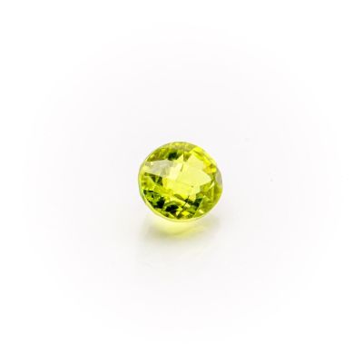 a yellow sapphire stone on a white background