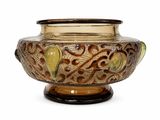 a vase that has a brown and green design on it