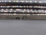 an image of a close up of a silver plate on a table