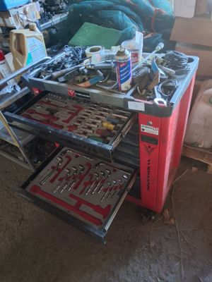 a workbench with tools on it in a garage