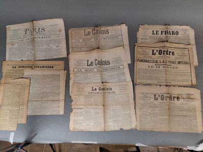 many old newspapers sitting on a table on the table