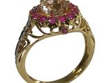 an image of a gold ring with a pink stone surrounded by pink stones