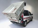 a small white truck with a large white box on the back of it