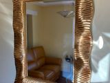 a mirror hanging on the wall in a living room