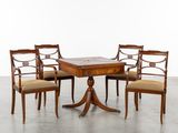 une image représentant un ensemble composé de quatre chaises et d'une table au plateau en marbre