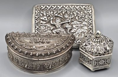 two silverplated boxes and a box with a design on the lid