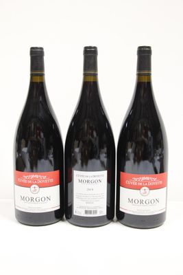 three bottles of wine sitting next to each other on a table