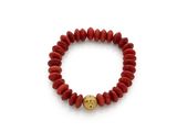 a red beaded bracelet with a gold ball on a white background