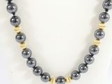 a close up of a necklace on a mannequin mannequin