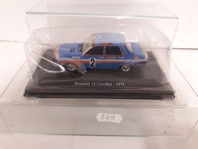 a blue and orange car in a clear display case