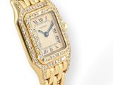 a lady ' s cartier watch with diamonds set in 18k yellow gold