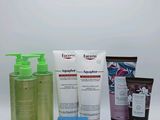 many different types of skin care products on a white surface