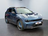 the blue suv is parked in a showroom with a black floor