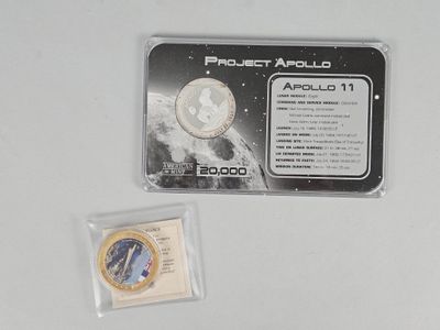 a picture of a coin and a card on a table
