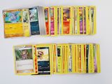 a lot of pokemon cards that are on the table
